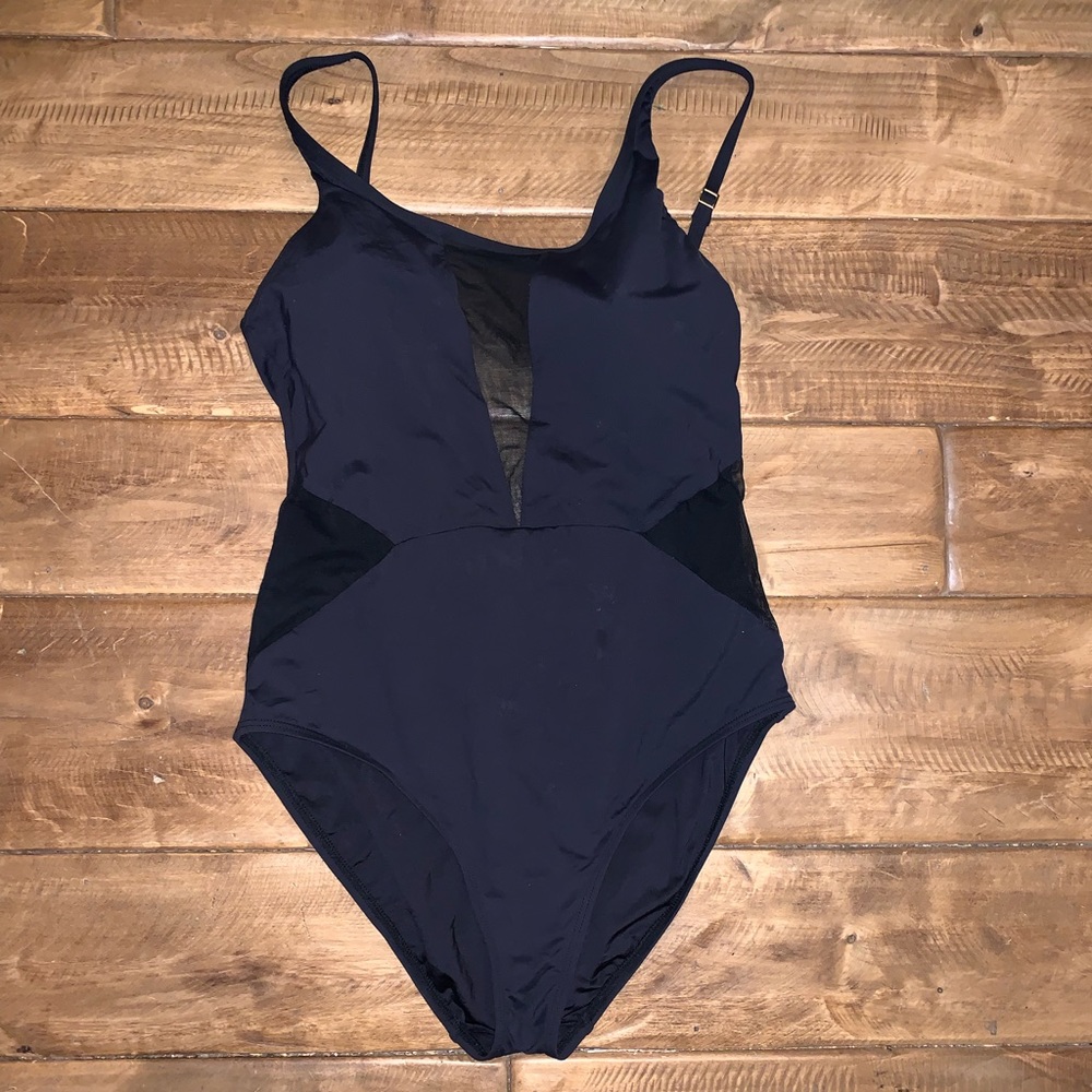 Black one piece swimsuit with mesh cut outs